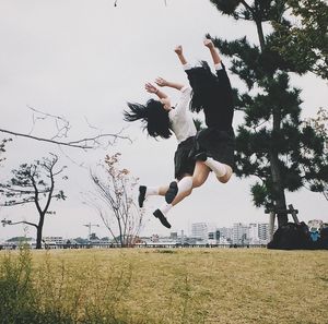 Woman jumping in park