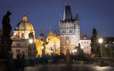 Illuminated buildings in city at night