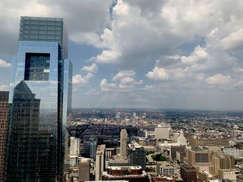 Modern buildings in city against sky