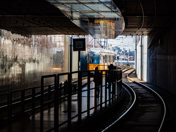 Budapest transport tram is comin to the stop in a tunnel