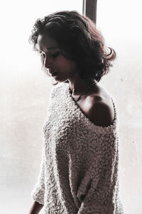 Portrait of young woman looking at camera