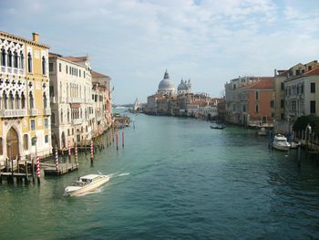 High angle view of canal amidst buildings in city