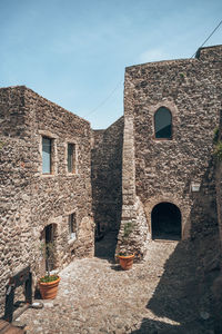 Low angle view of old ruins against sky