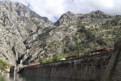 Scenic view of canal against mountains