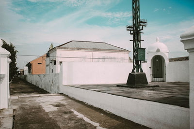 Street amidst buildings in city against sky