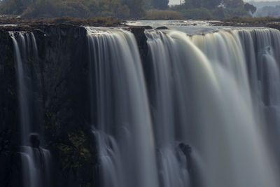 Panoramic view of waterfall in forest