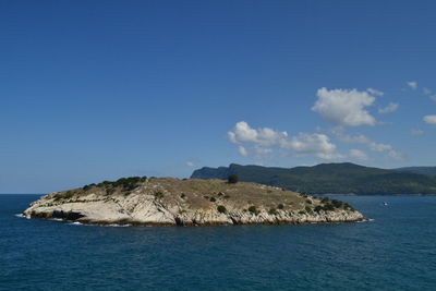 Scenic view of sea and rocks against sky