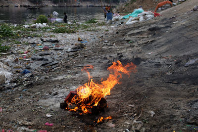 High angle view of fire and environmental pollution