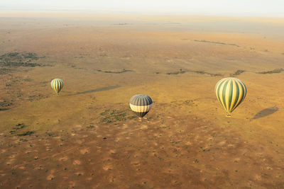 Hot air balloon flying over land