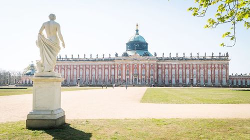 Statue of historic building against sky