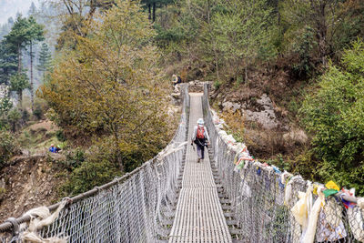 People walking on footbridge