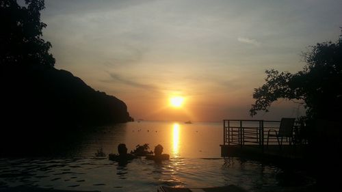 Scenic view of sea against sky at sunset