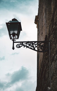 Low angle view of street light against sky