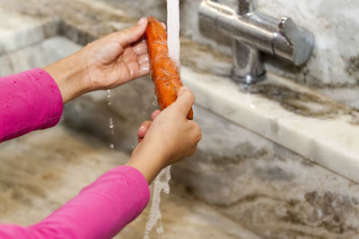 Close-up of hand holding ice cream