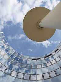 Low angle view of building against cloudy sky