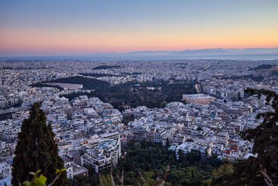 Aerial view of townscape against sky during sunset