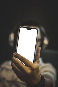 Close-up of hand holding smart phone