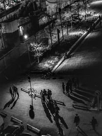 High angle view of people on street at night