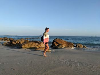 Woman walking on beach