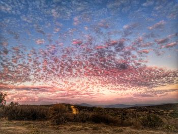 Scenic view of dramatic sky during sunset