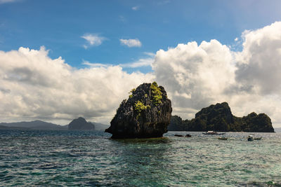 Scenic view of sea against cloudy sky