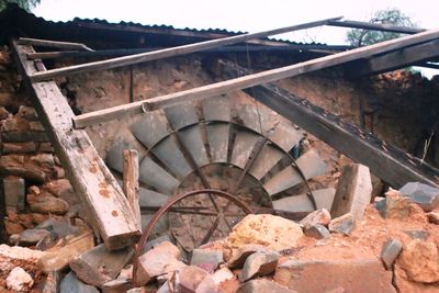 Staircase by stone wall