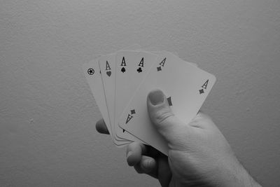 Close-up of human hand against the sky