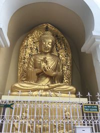 Low angle view of statue against building