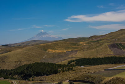 View of volcanic landscape against blue sky