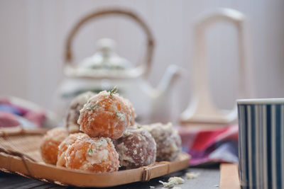 Close-up of ice cream in basket on table