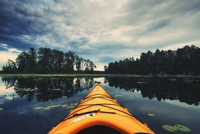 Reflection of trees on lake against sky