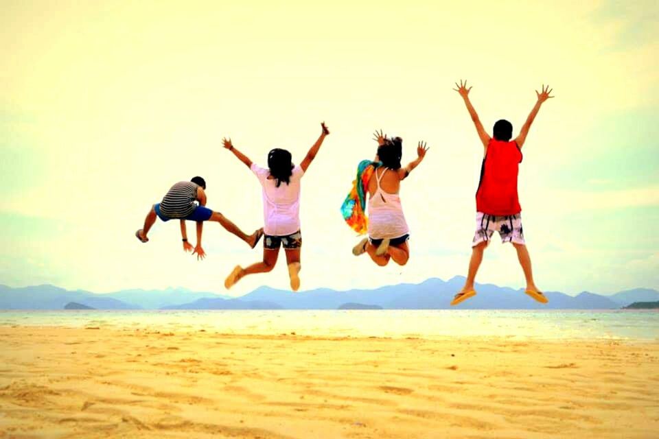 PEOPLE PLAYING ON BEACH