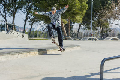 Man skateboarding in park