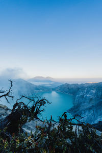 Scenic view of mountains against blue sky