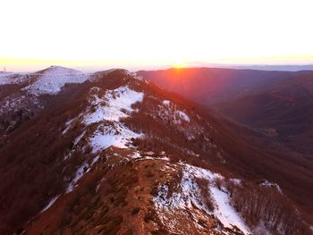 Scenic view of mountains against sky during sunset