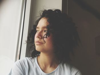 Portrait of beautiful young woman at home