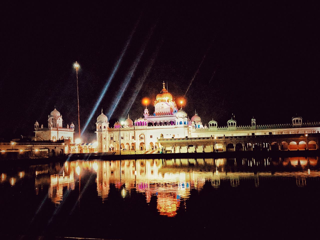 REFLECTION OF ILLUMINATED BUILDINGS IN RIVER