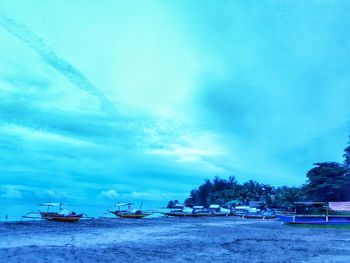 Scenic view of sea against blue sky