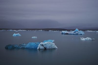 Scenic view of sea against sky during winter