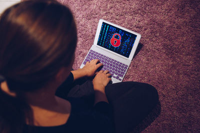 High angle view of woman using laptop