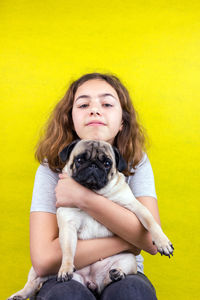 Portrait of a young woman with dog