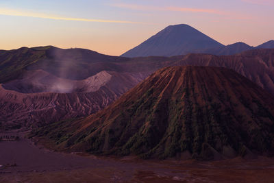 Panoramic view of volcanic landscape against sky during sunset