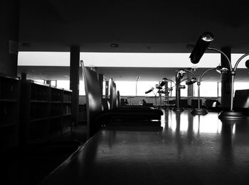 Empty chairs and tables in corridor