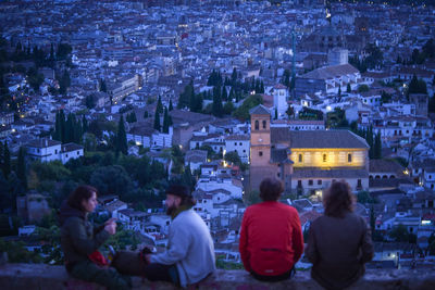 High angle view of people sitting outside building