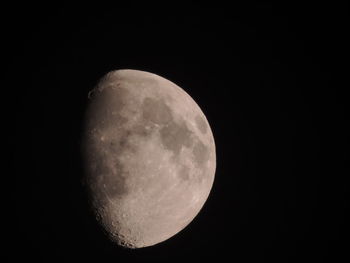 Low angle view of moon against clear sky at night