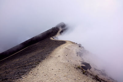 Scenic view of volcanic mountain against sky