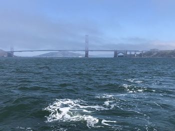 Scenic view of bay bridge against sky