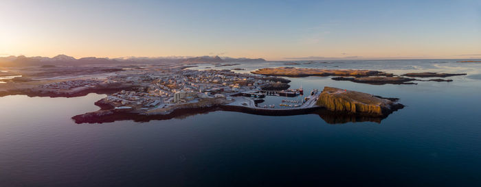 Aerial view of sea against sky during sunset