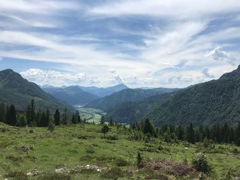 Scenic view of landscape and mountains against sky