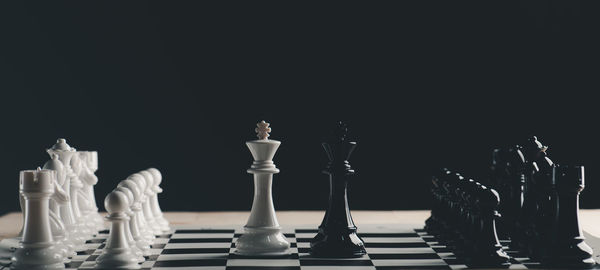 Full frame shot of chess board against black background